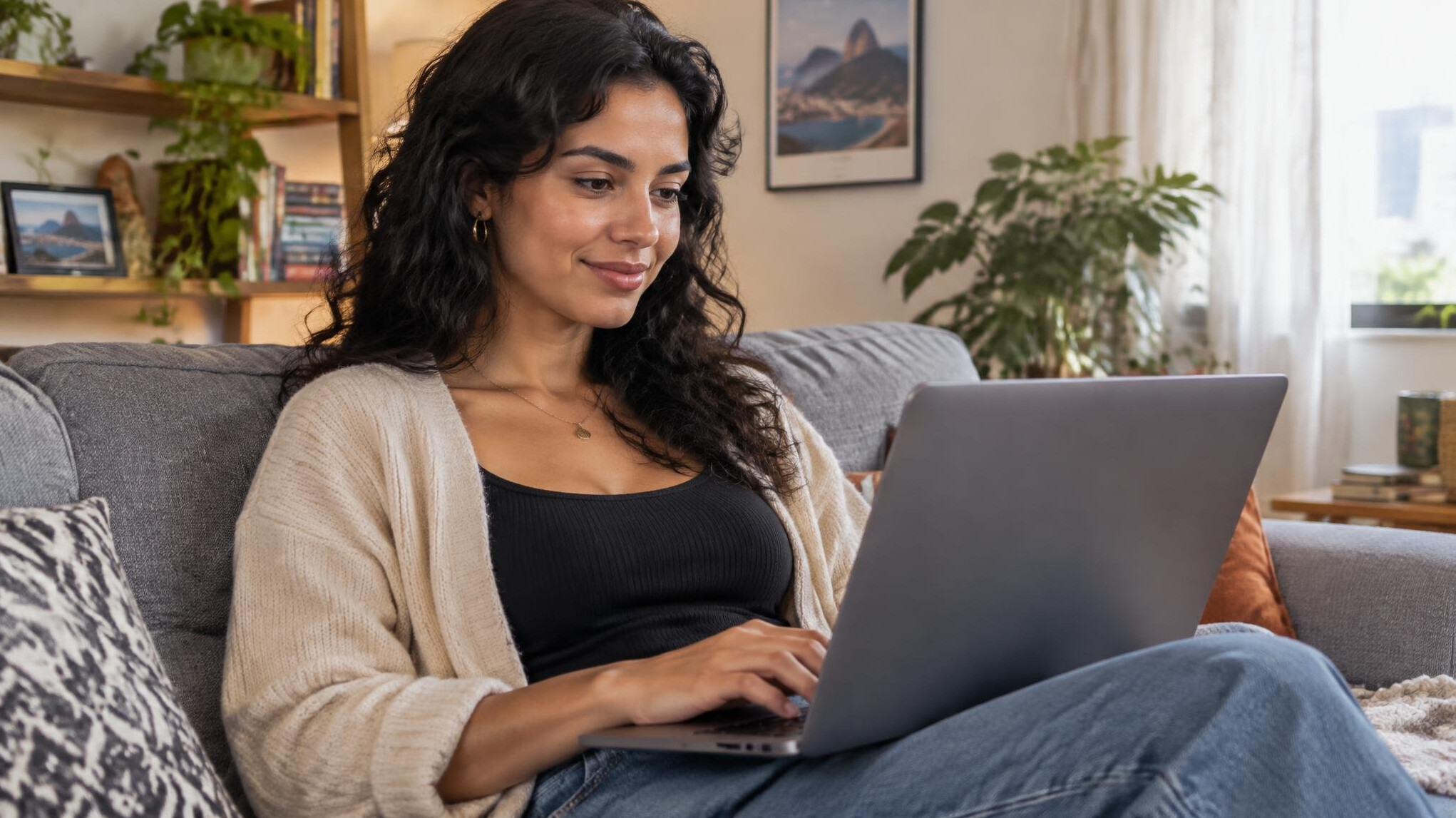 Person writing a message on a laptop at home
