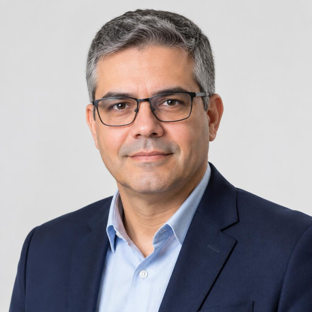Studio portrait of a Brazilian man with glasses