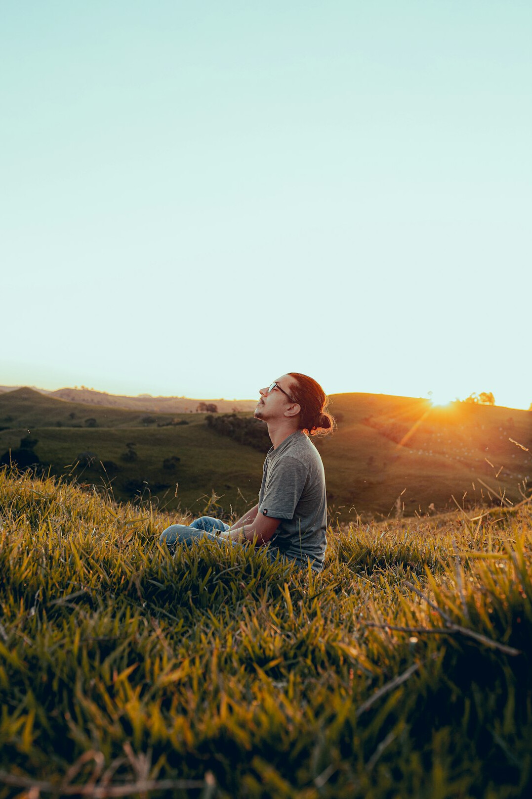 person meditating in nature